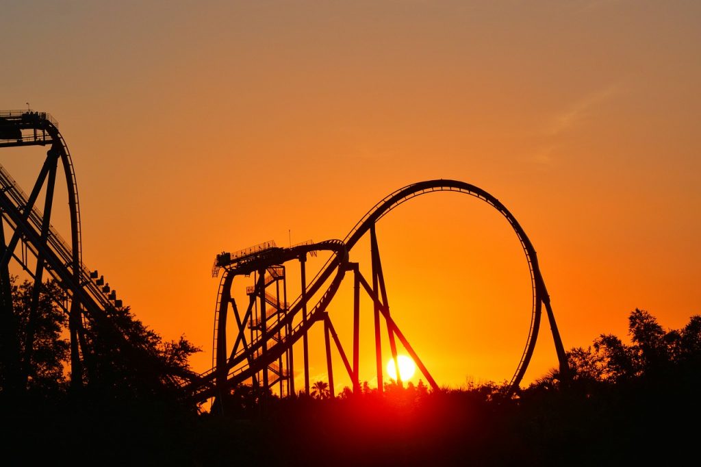 Golden sunset with an abandon roller coaster in view. 
