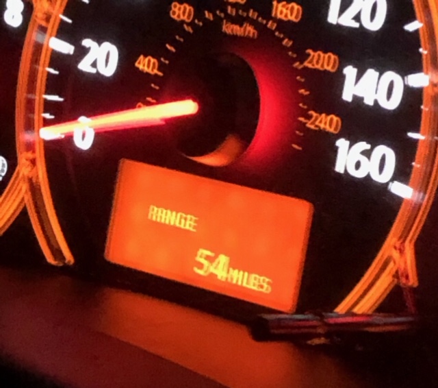 Photo of odometer showing 54 miles to empty