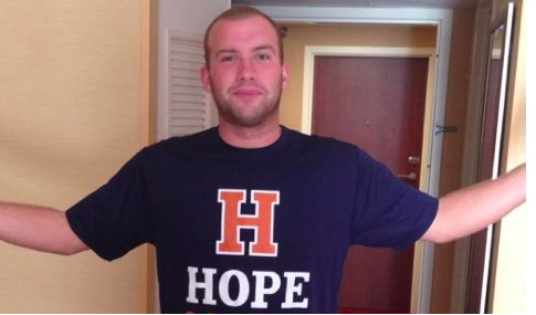 standing tall with a hope t shirt on is Joel after he was healed